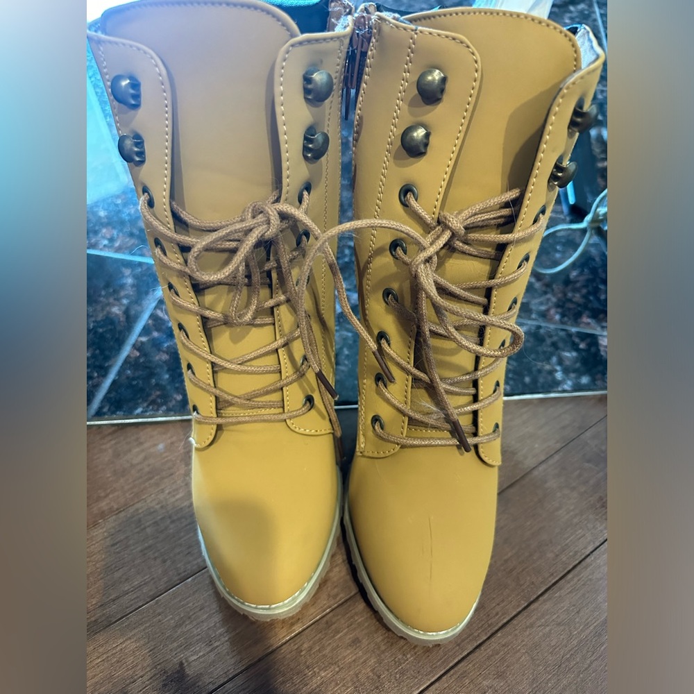 Woman tan heeled boots